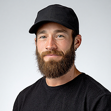 A man wearing black shirt and hat