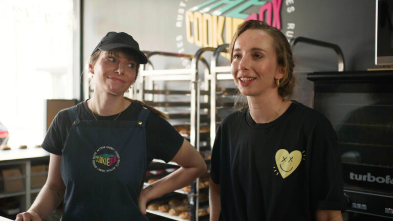 Two Cookie Box bakery staff members sharing their experience using Connecteam.